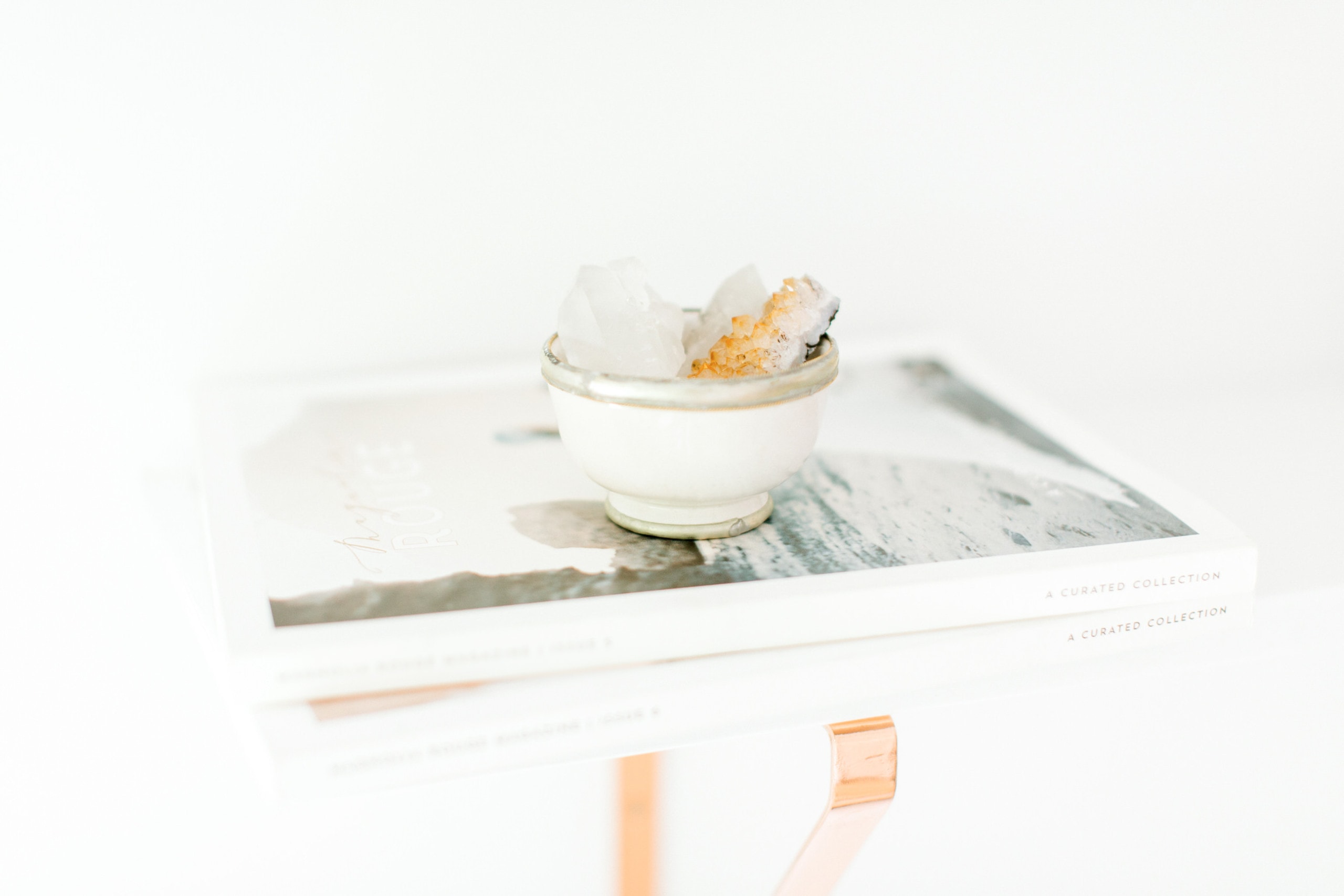 crystals and magazine on shelf