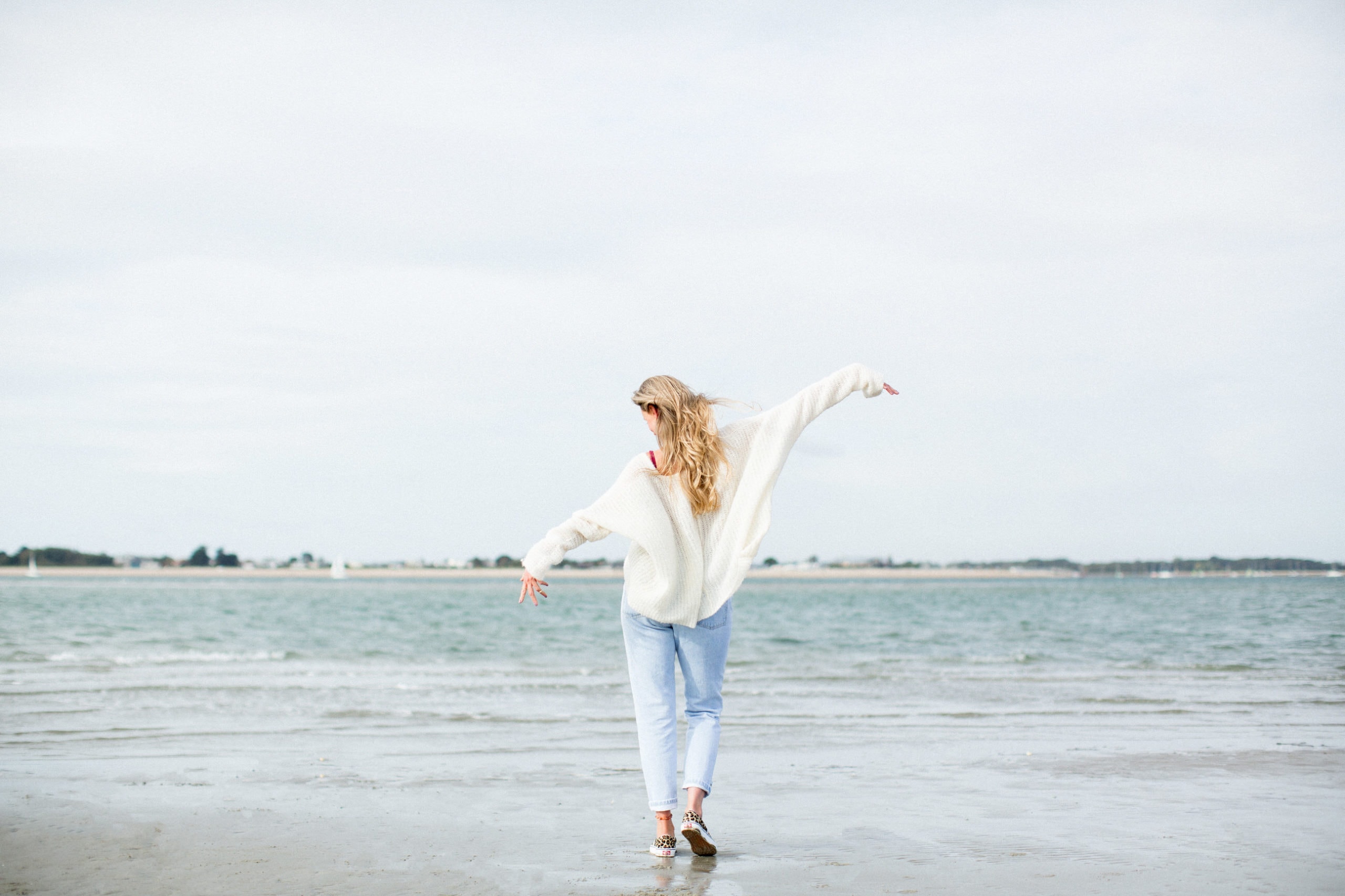woman walking on beach
