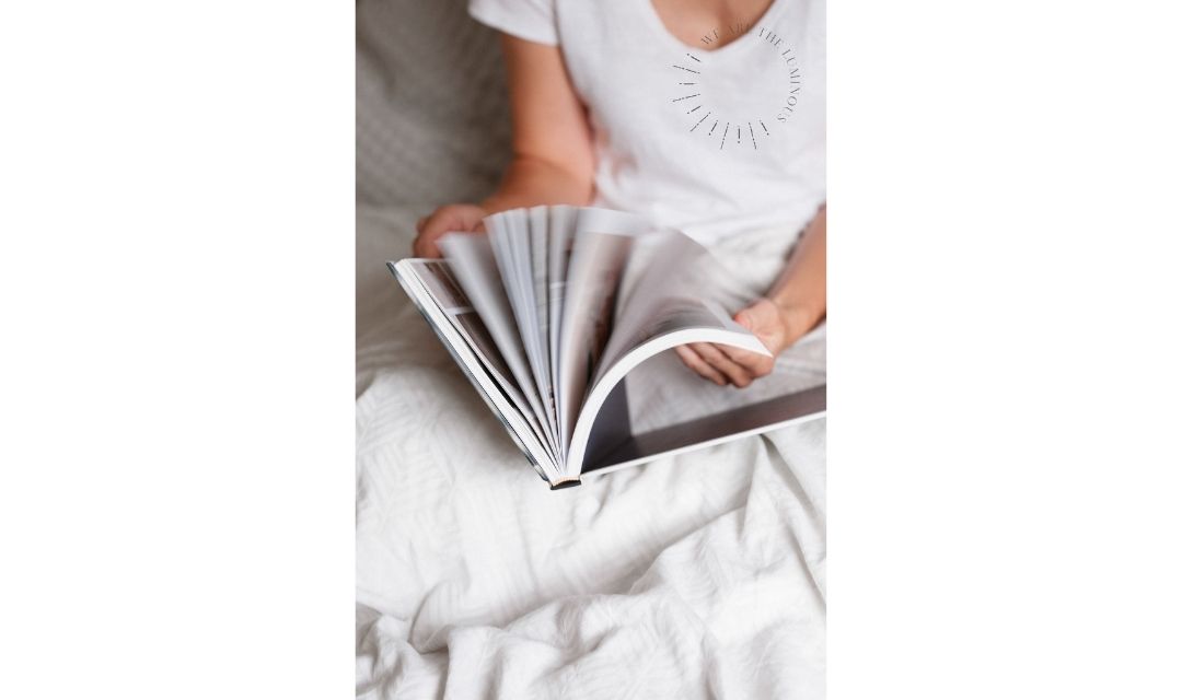 hands looking at magazine