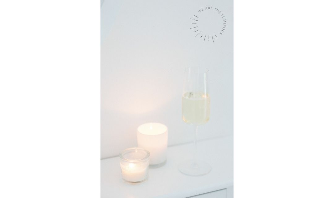 scented candles and glass of champagne