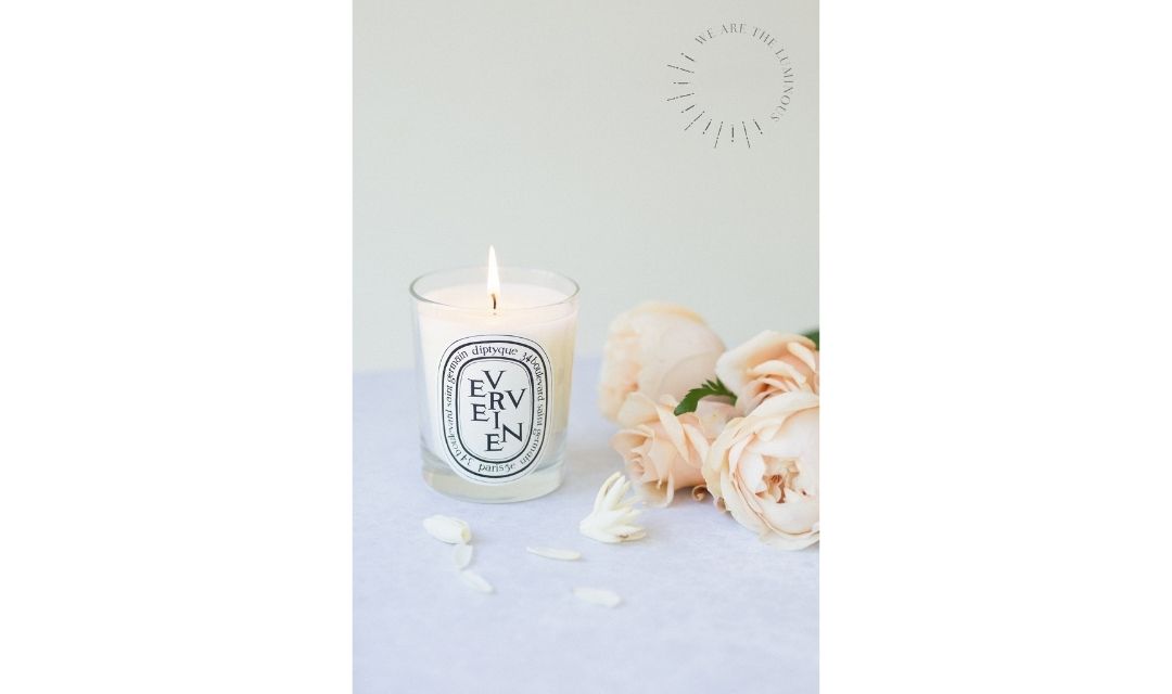 scented candle with bunch of roses