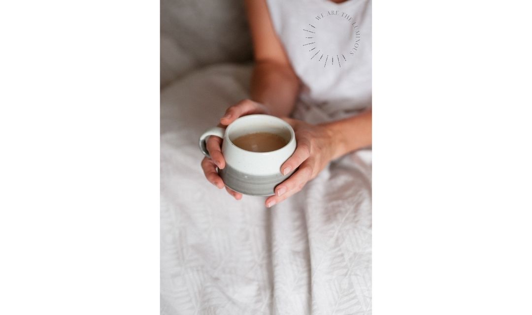 hands holding a cup of tea