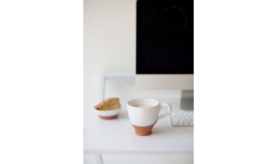 mug of coffee on office desk stock photo