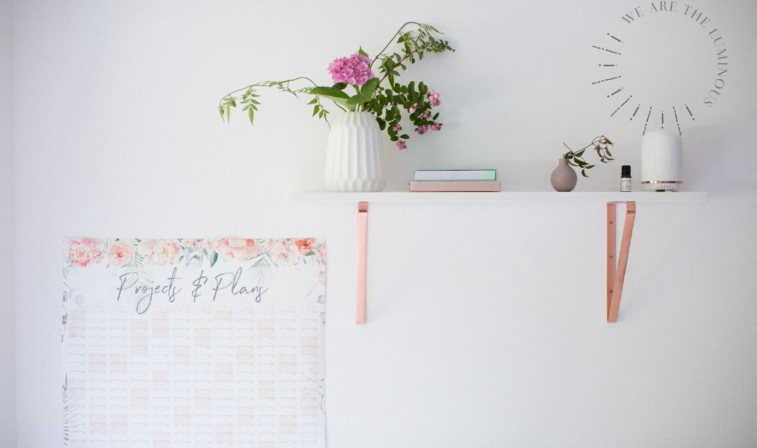 flowers in vase and wall planner