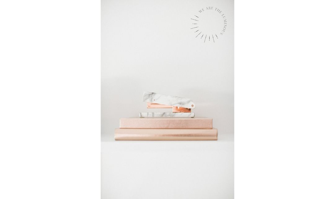 rose gold notebooks and stapler