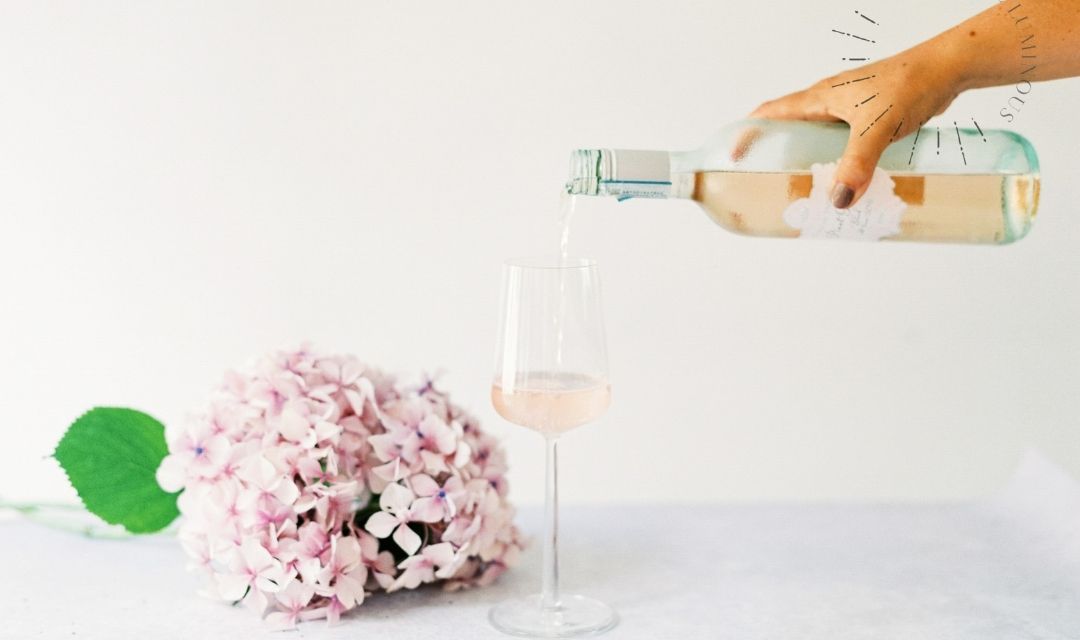 glass of rose being poured