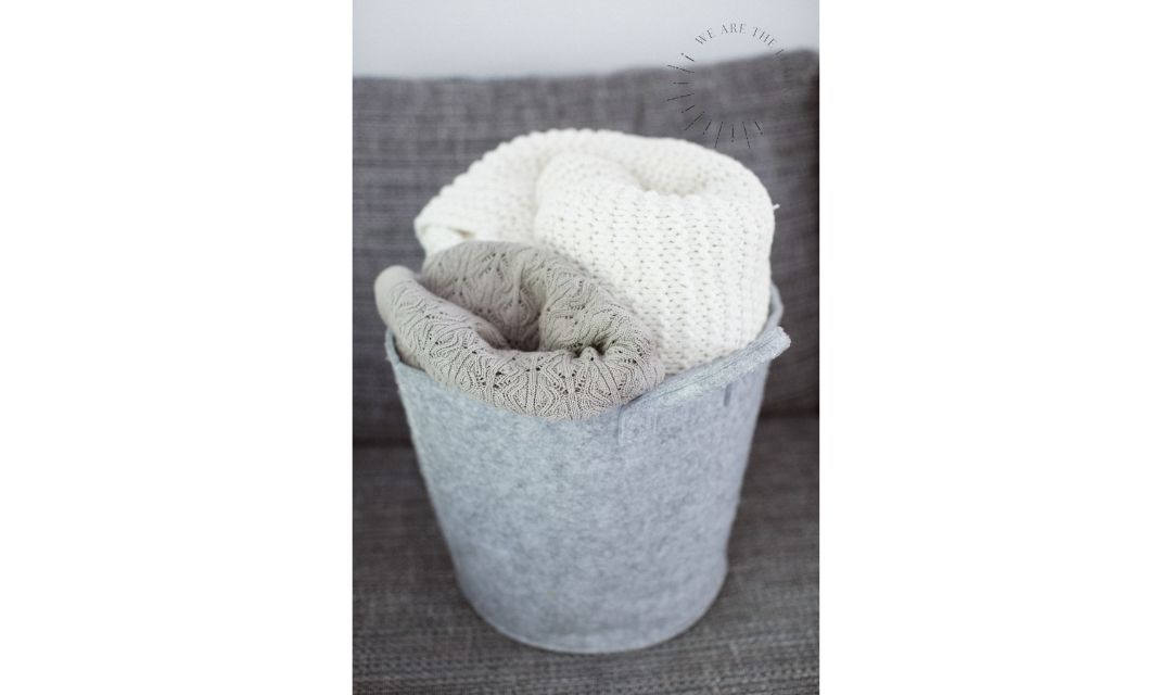 blankets in basket stock photo