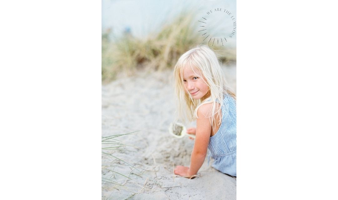 little girl in sand dunes