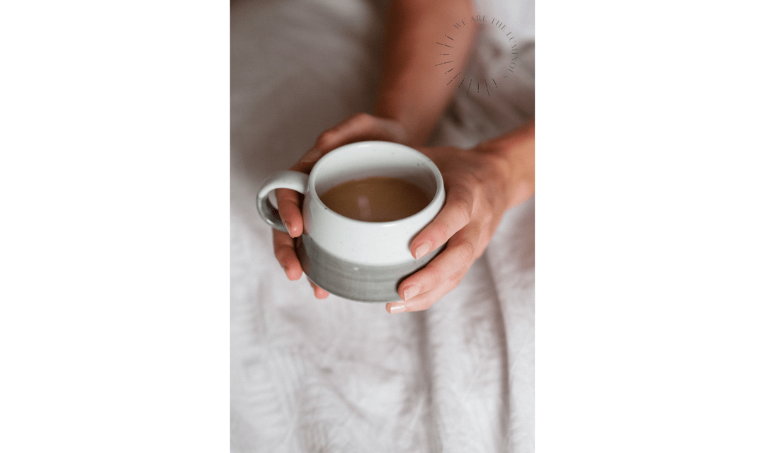 hands holding a cup of tea stock photography