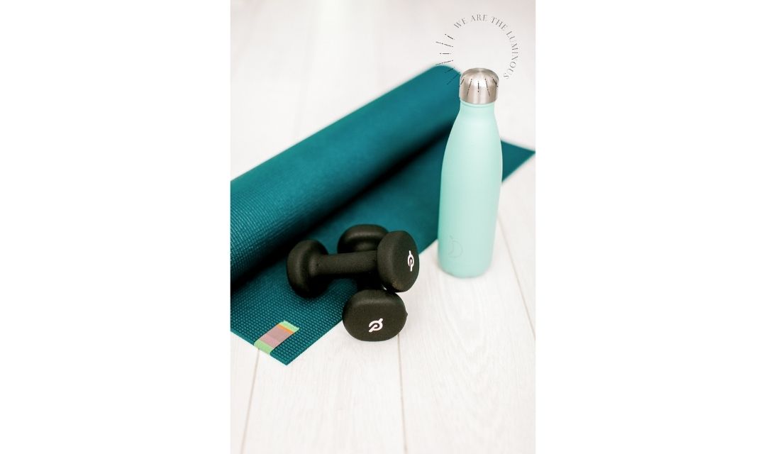 weights and yoga mat stock