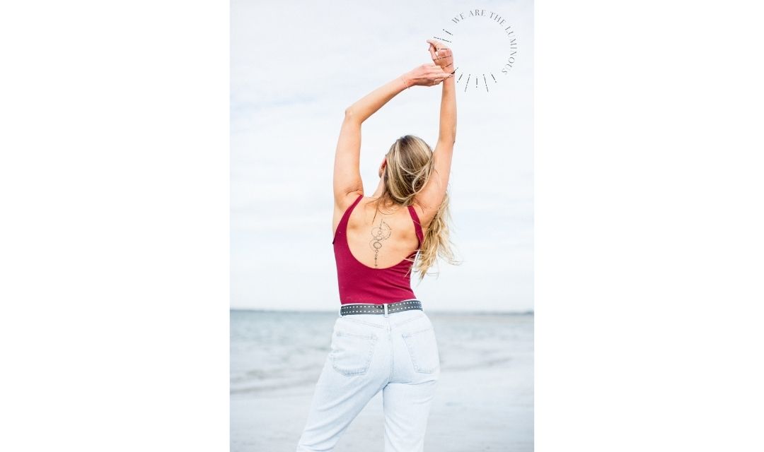 back of woman in pink top