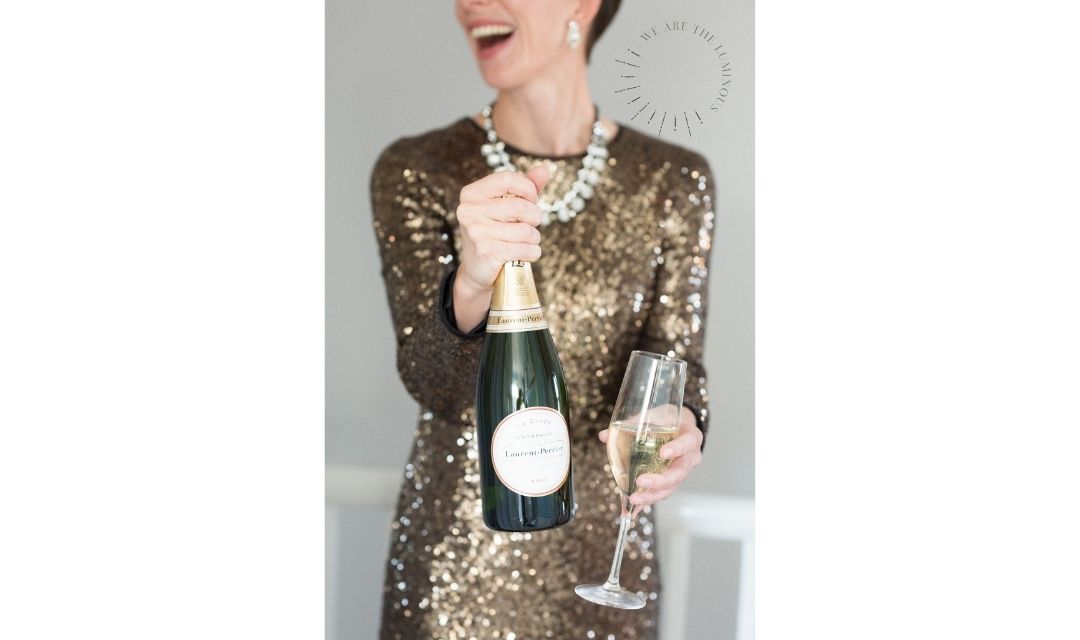 woman holding champagne