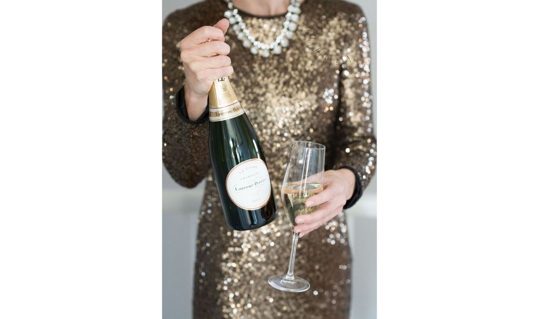 woman holding champagne