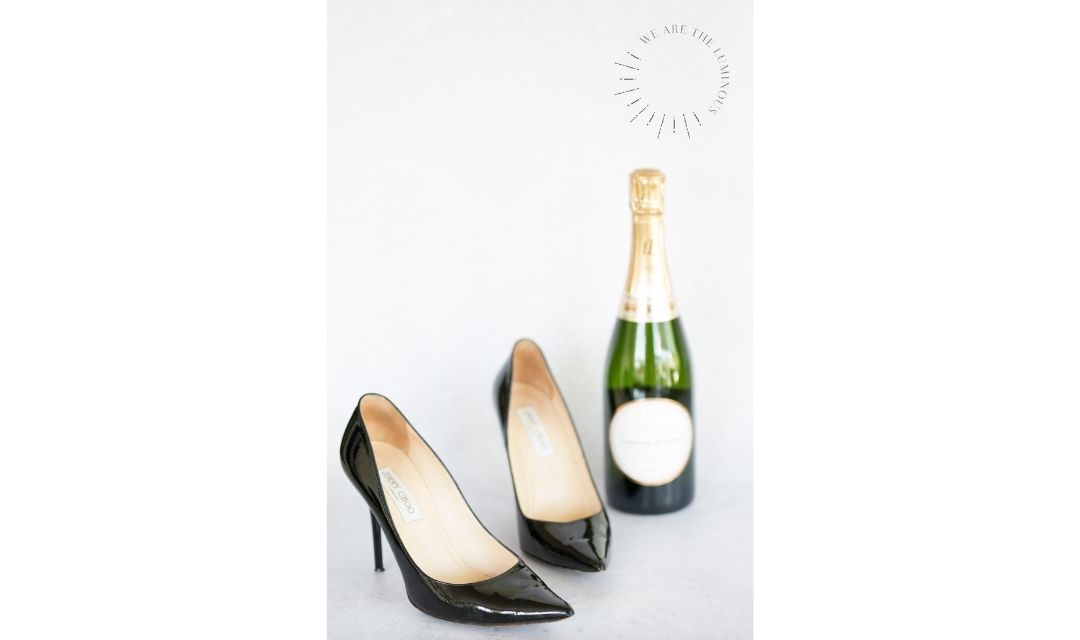 black Jimmy Choos with champagne