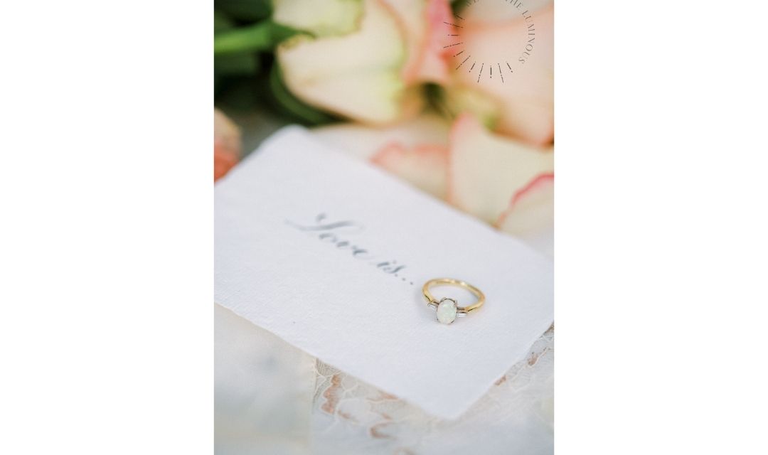 opal engagement ring with love quote and roses