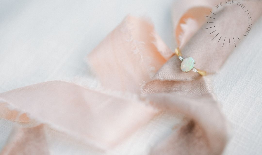 opal engagement ring with ribbons