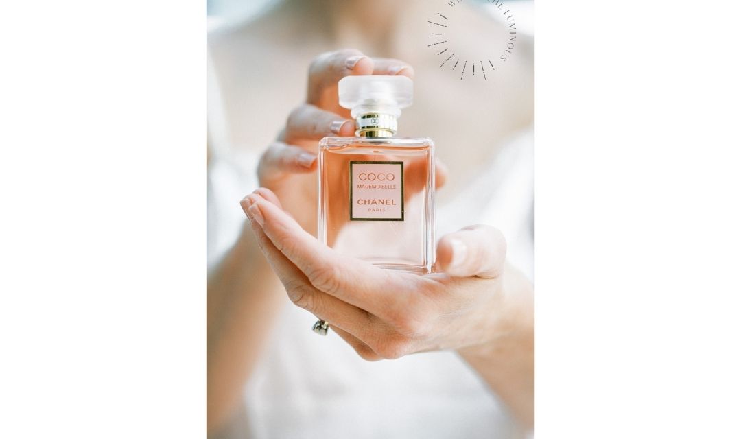 woman holding perfume