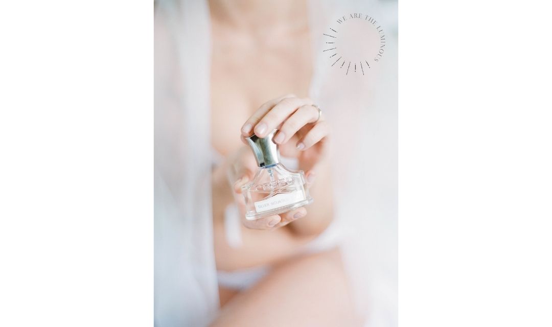 bride holding perfume